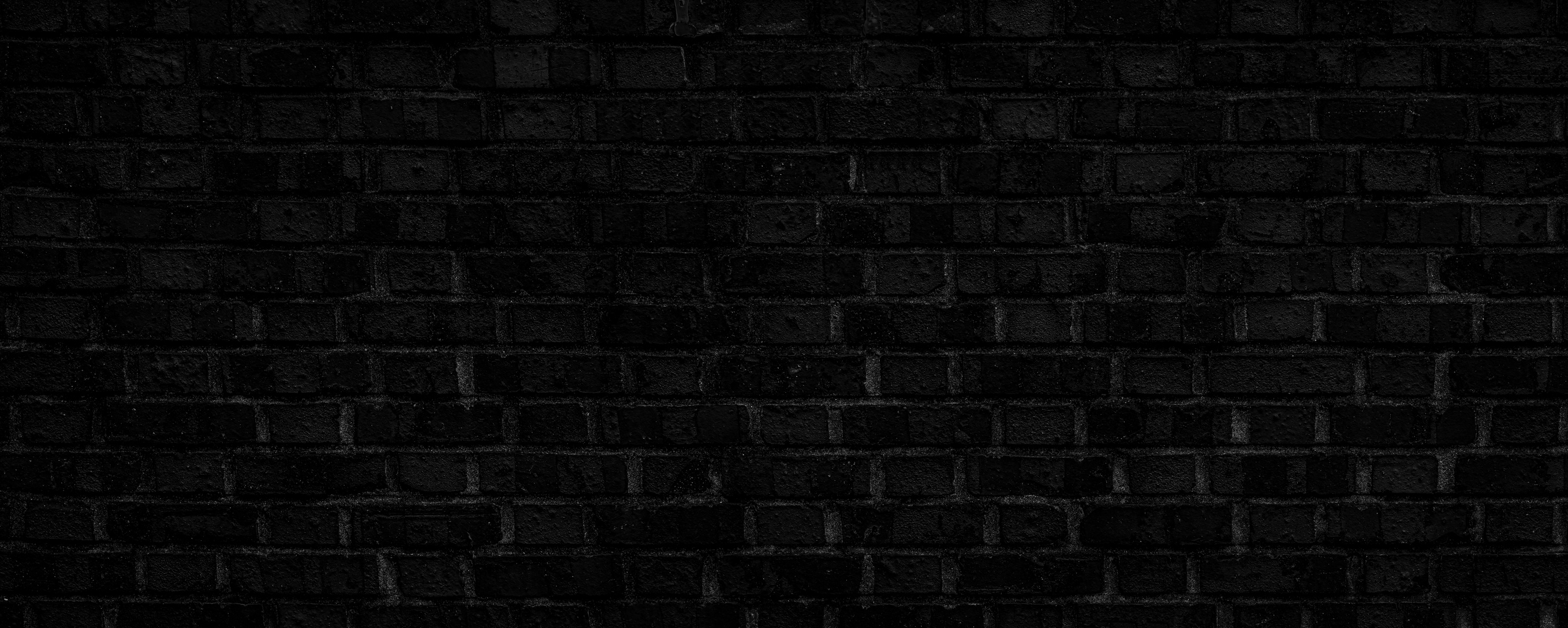 dark, dirty, rough-textured black brick background